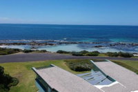 Boathouse nearly in the water  wonderful views