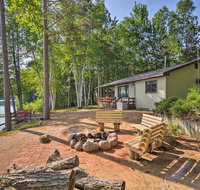 Lakefront Manistique Cabin with Private DockFire Pit